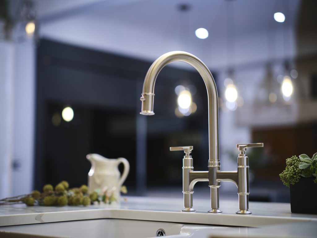 Modern chrome kitchen faucet with a sleek design and elegant finish, enhancing the kitchen's contemporary aesthetic.