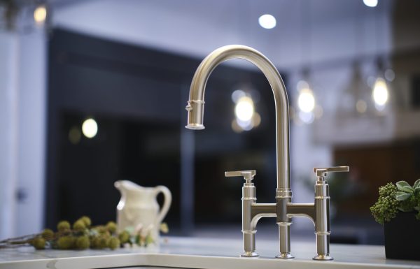 Modern chrome kitchen faucet with a sleek design and elegant finish, enhancing the kitchen's contemporary aesthetic.